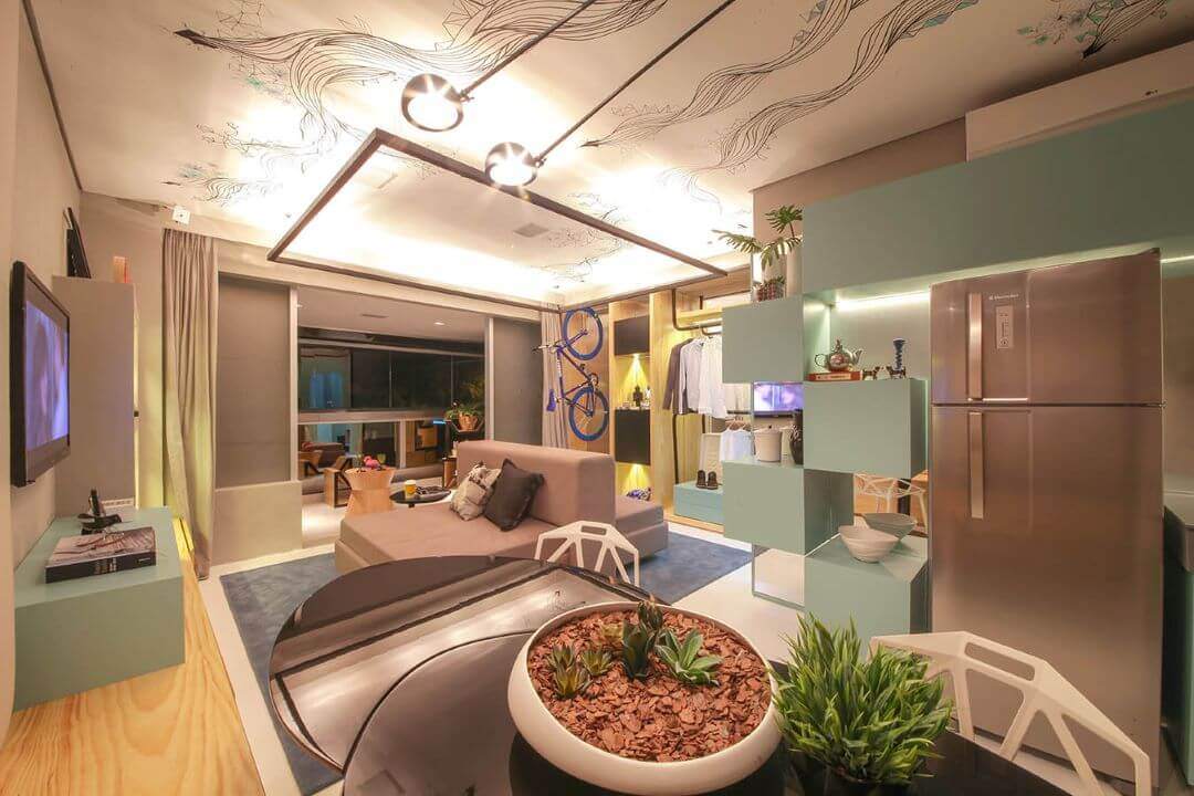 Foto de um loft para solteiros decorado com móveis bege e verde.